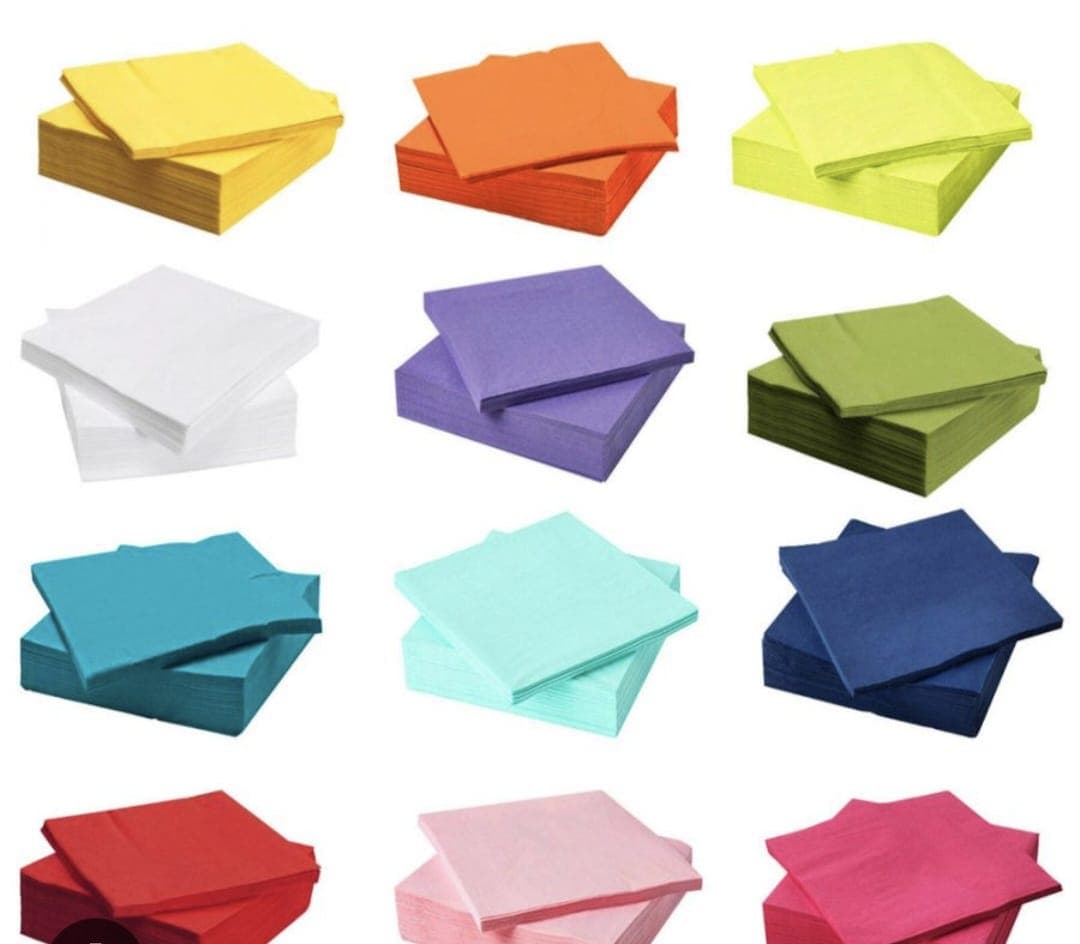 Colourful paper napkins arranged by shade